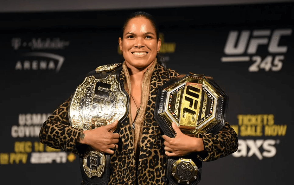 Amanda Nunes with her two division championship belts. Source: Josh Hedges/Zuffa LLC via Getty Images
