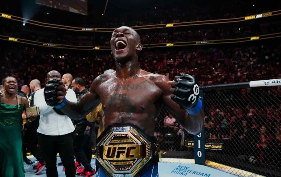 Israel Adesanya celebrates reclaiming his champion belt at UFC 287. Source: MMA Mania