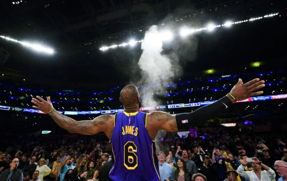 LeBron James celebrating in front of Lakers fans after breaking the NBA’s all-time scoring record. Source: Ashley Landis / Associated Press